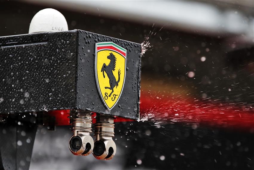 Ferrari badge in the rain